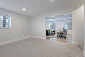 Unfurnished room with light colored carpet