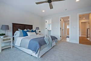 Bedroom featuring ceiling fan and light carpet