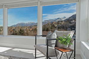 Sunroom / solarium with a mountain view