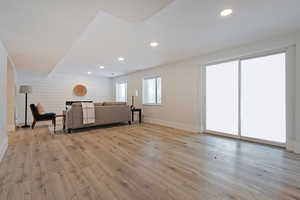 Living room with light wood-type flooring