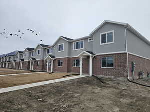 View of front of property featuring a front yard