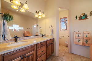 Bathroom featuring vanity and tile patterned floors