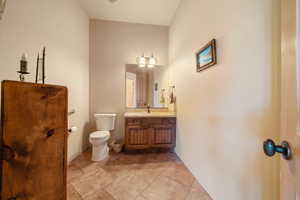 Bathroom featuring vanity and toilet