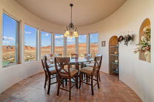 Dining area featuring a mountain view and a chandelier