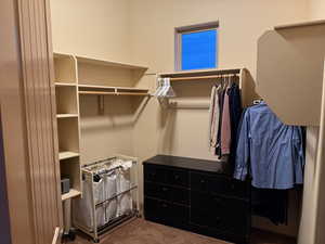 Walk in closet featuring carpet