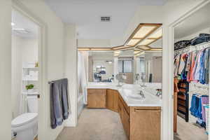 Bathroom with vanity and toilet