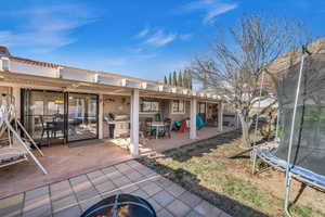 Exterior space with a patio and a trampoline