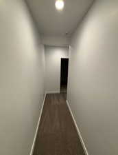 Corridor with dark colored carpet