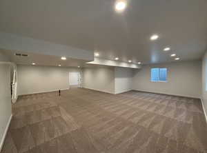 Basement with carpet flooring