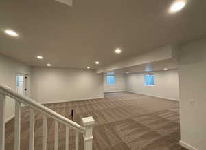 Basement featuring carpet flooring