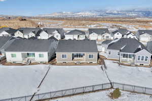 Snowy aerial view featuring a mountain view