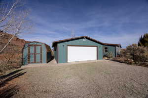 Exterior space with a storage unit and a front lawn