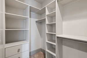 Spacious closet with carpet flooring