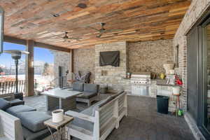 View of patio featuring ceiling fan, grilling area, an outdoor living space, and area for grilling