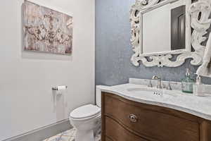 Bathroom featuring vanity and toilet