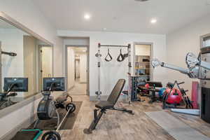 Workout room featuring light hardwood / wood-style flooring