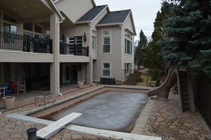 Back of house featuring a patio area and central air condition unit