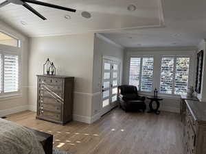 Bedroom featuring crown molding and hardwood / wood-style floors