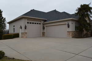 View of property exterior with a garage