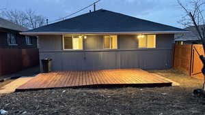 Back of house featuring a wooden deck