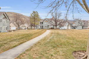 Exterior space with a mountain view and a front lawn