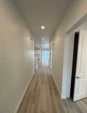 Hallway featuring light hardwood / wood-style floors