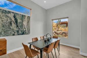 Dining space with light hardwood / wood-style flooring