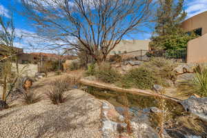 View of yard with a garden pond