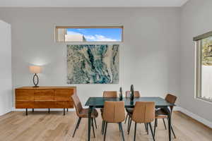 Dining room featuring wood finished floors and baseboards