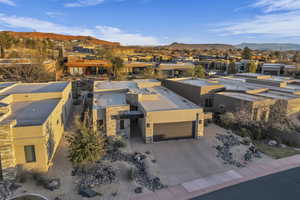 Aerial view of residential area featuring mountains