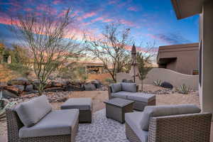 Patio terrace at dusk with an outdoor hangout area