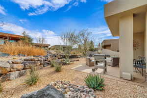 View of yard featuring an outdoor living space and a patio