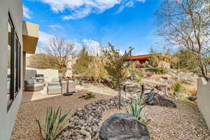 View of yard with outdoor lounge area and a patio area