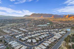 Drone / aerial view featuring a water and mountain view