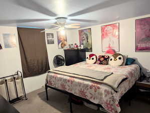 Bedroom featuring light carpet and ceiling fan