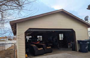 View of detached 2 car extra wide tandem garage