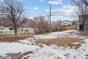 View of yard covered in snow