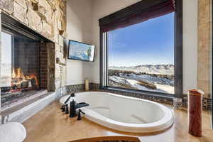 Bathroom featuring tiled bath