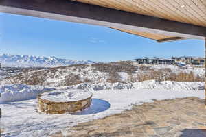 Snowy yard with a mountain view