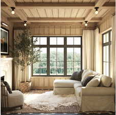 Sunroom featuring beamed ceiling, plenty of natural light, and wood ceiling