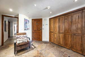 Entryway featuring a textured ceiling