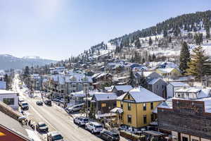 Snowy aerial view with a mountain view