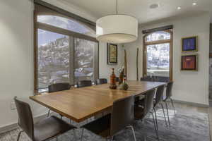 Dining area with hardwood / wood-style floors