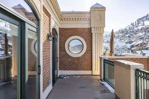 View of snow covered back of property