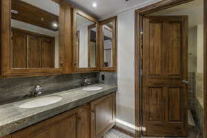 Bathroom with vanity and decorative backsplash