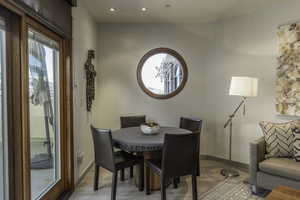 Dining space with light hardwood / wood-style flooring