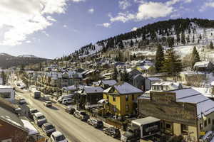 Snowy aerial view with a mountain view