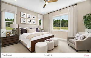 Carpeted bedroom with ceiling fan