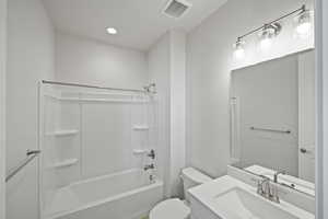 Full bathroom with vanity, shower / washtub combination, and toilet