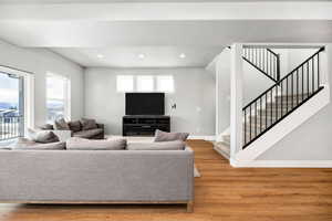 Living room with light hardwood / wood-style floors